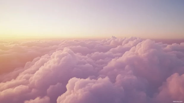 A dreamy landscape of pastel colored clouds during the golden hour.