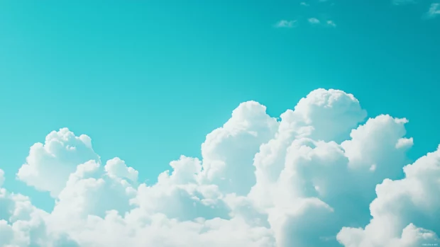 Bright white clouds floating against a clear, vibrant blue sky.