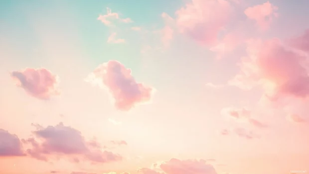 Soft pink clouds drifting across a pastel sunset sky, with subtle hints of orange and lavender in the distance.