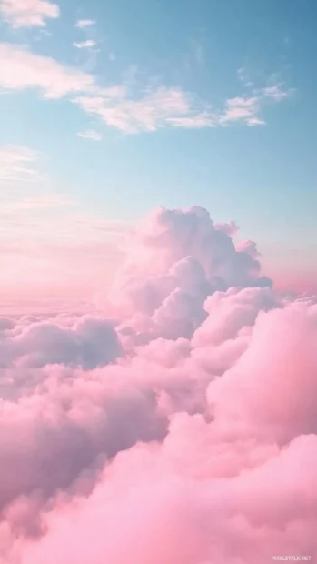 Majestic pink clouds swirling in a dramatic sky over an ocean horizon.