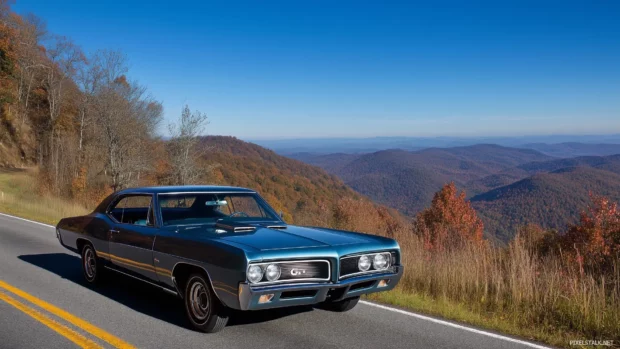 A 1967 Pontiac GTO on a mountain road, surrounded by autumn foliage and a clear blue sky.