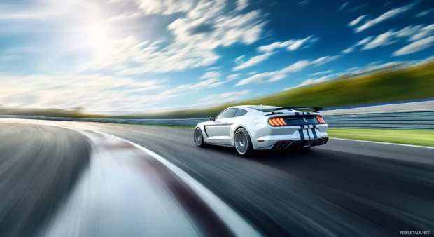 A Mustang Shelby GT500 racing on a closed racetrack, with motion blur showcasing the cars power and agility as it zooms around the curve under a bright blue sky.