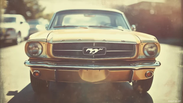 A classic 1960s Ford Mustang captured in a faded Polaroid frame, with a retro film grain effect and warm tones.