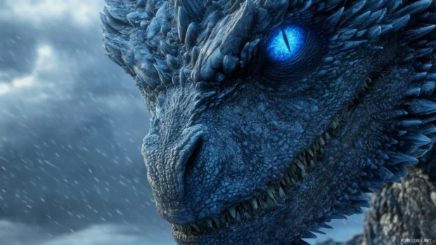 A close up of a blue Dragon face, its icy blue eyes glowing intensely, and frost forming on the tips of its scales.