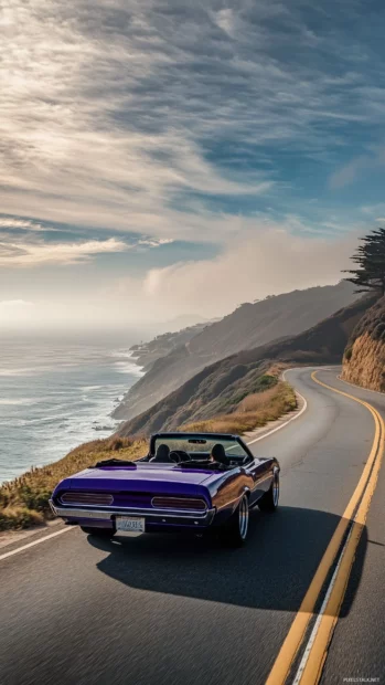 A purple convertible roadster, cruising down a coastal highway.