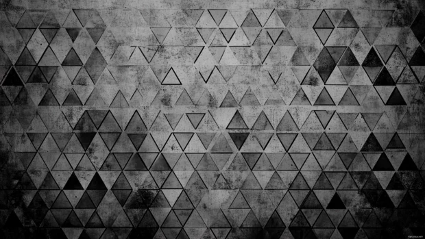 A simple computer wallpaper with a geometric triangle pattern in monochrome shades, creating a sleek and modern design.