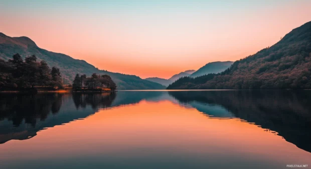 A simple wallpaper of a smooth, tranquil lake reflecting the soft hues of the sky.