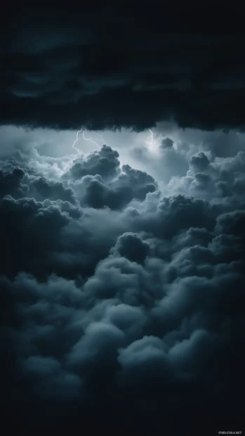 Cloud iPhone wallpaper with Majestic thunderclouds building up in a dark, brooding sky.