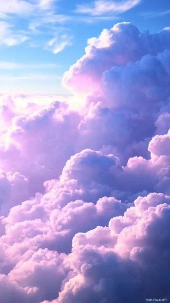 Dreamy blue clouds with subtle hints of purple, hovering over a tranquil landscape at dusk.