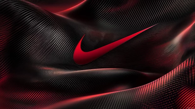 Dynamic Nike background with a swoosh logo integrated into a high contrast black and red geometric pattern.