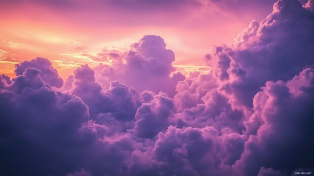 Light purple clouds with subtle pink hues blending into a vibrant sunset, creating a beautiful gradient across the sky.