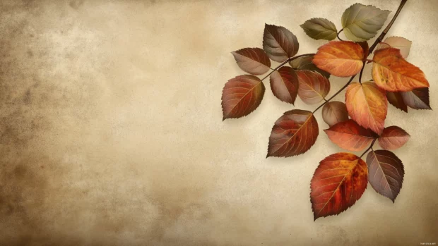 Vintage autumn leaves in warm shades of brown and orange, gently overlapping on a soft, grainy background.