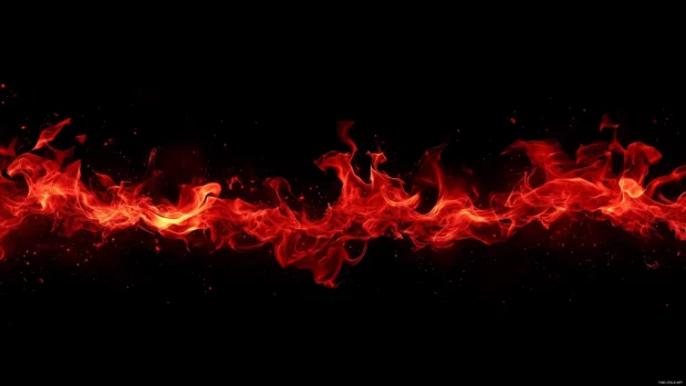 Vivid red flames curling and dancing upward, with intense heat radiating against a pure black background.