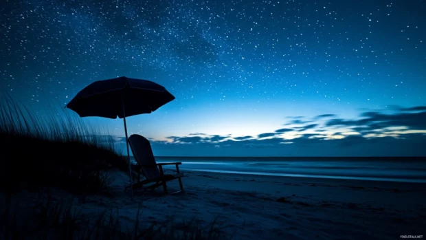 A beach chair and umbrella silhouetted against a dark starry sky for PC wallpaper.