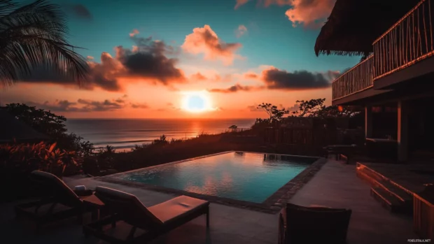 A beachside hotel with a swimming pool and lounge chairs wallpaper.