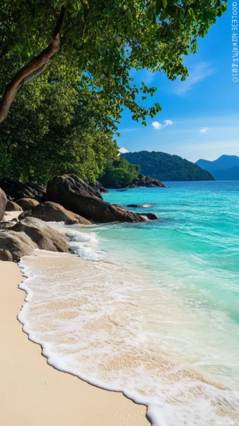 A cool beachy scene with crystal clear turquoise waters and white sand.