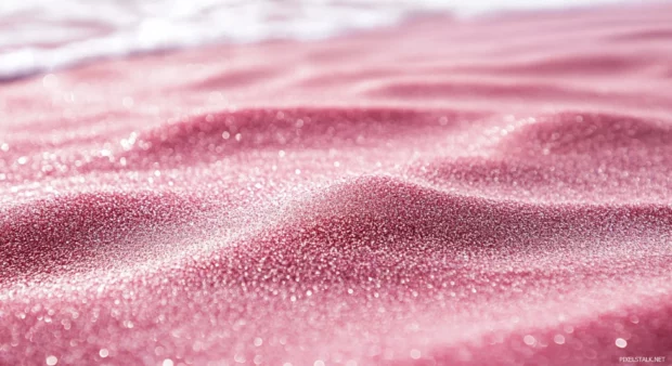 A pink beach with a close up of pink sand for desktop background.