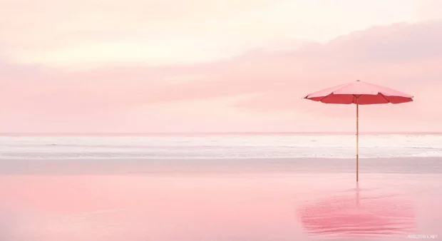 A pink beach with a minimalist design, showing a pink umbrella and a pink beach chair.