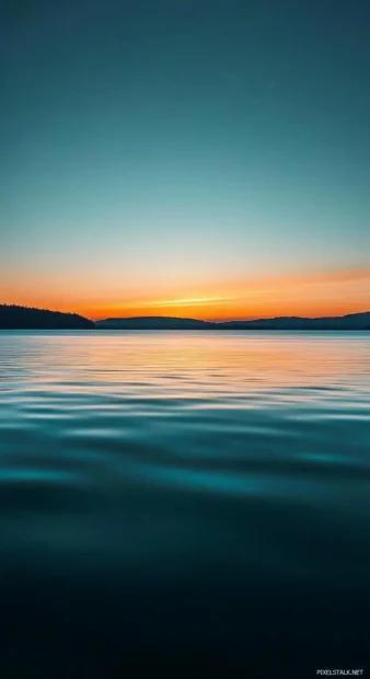 A time lapse photo of a sunset over the blue ocean, with the colors changing and blending together (2).