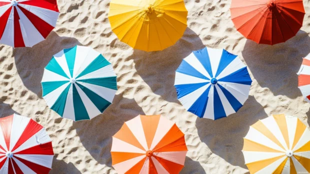 Collage of beach umbrellas with colorful patterns, different sizes, and shadows on the sand.