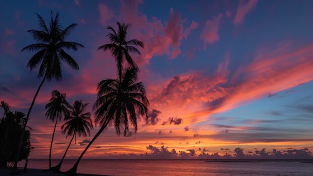 A breathtaking sunset over a tropical beach with palm trees silhouetted against the vibrant sky 3.