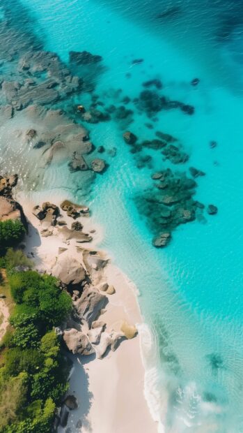 A cool tropical beach iPhone wallpaper with crystal clear turquoise waters and white sand.