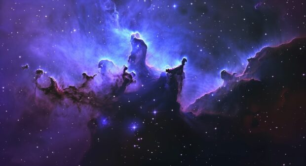 A majestic view of a nebula with blue and purple gas clouds, interspersed with bright stars and cosmic dust, creating a sense of wonder and awe.