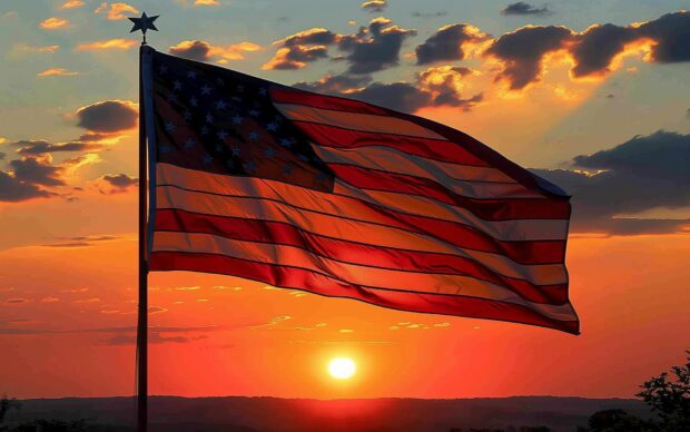 American flag with a sunrise backdrop.