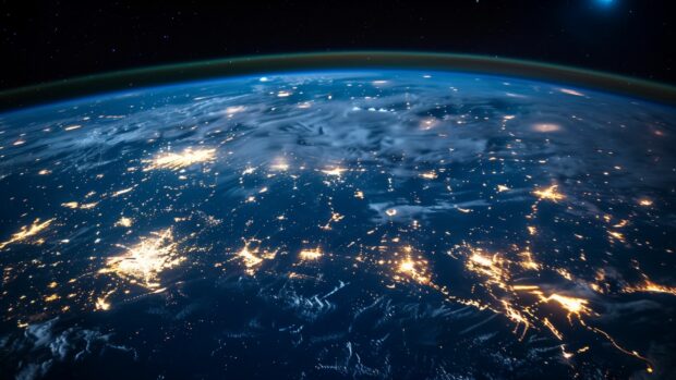 An awe inspiring image of Earth from space at night, with city lights glowing like stars on the surface, showcasing the beauty of our planet, 2K wallpaper.