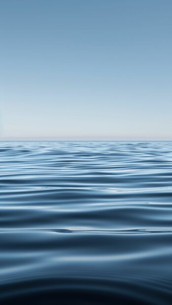 Android Wallpapers HD  with a calm sea with gentle ripples and a clear blue sky.