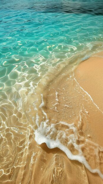 Beach 4K iPhone wallpaper with crystal clear waters and a smooth, sandy shore, framed by gentle waves.