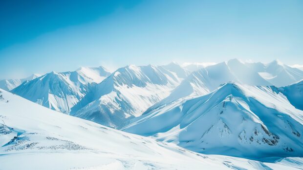 Bing Daily 4K background with Snow covered mountains under a clear blue sky, pristine white slopes.