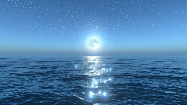 Free download Cool Blue Space background with a tranquil scene of a blue moon rising over an alien ocean, with stars reflecting off the water surface and a blue hued sky.