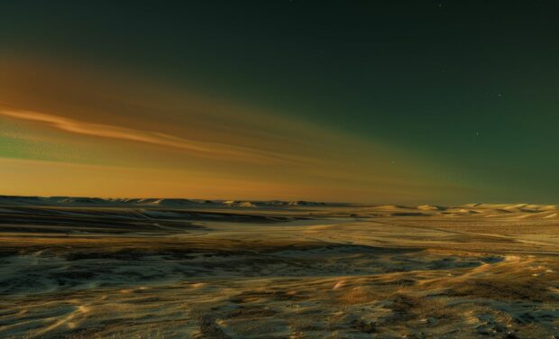 Northern Lights landscape with snowy hills and a clear night sky.