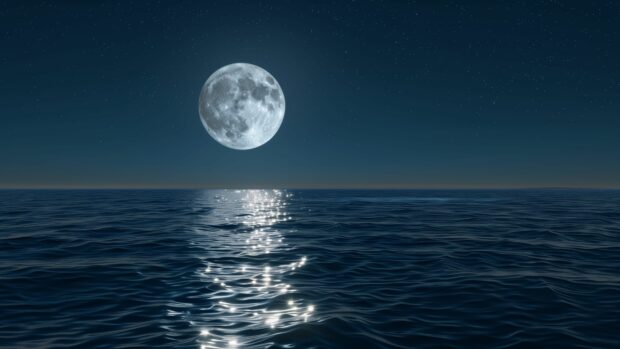 Ocean 4K desktop background with a full moon casting a silver glow over a peaceful ocean at night.