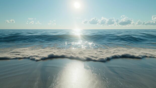 Ocean background HD with a bright sunny day over a calm ocean with gentle waves lapping the shore.