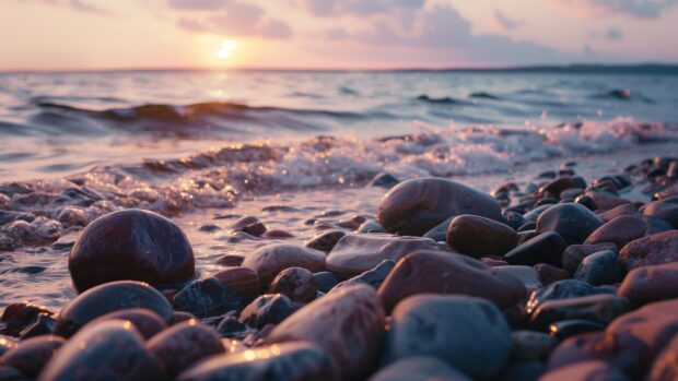 Serene beach with smooth rocks, gentle waves, colorful sunrise 2.