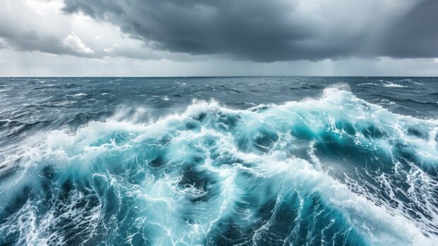 Waves crashing in a tumultuous ocean storm under dark clouds, HD background.