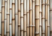 A bamboo wood wallpaper with a light, natural color and vertical lines.