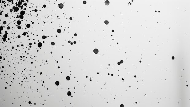 A clean, white 4K wallpaper with a minimalist black dot pattern.