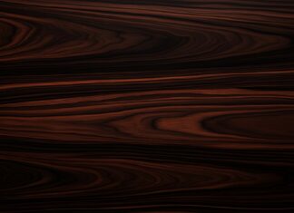 A dark ebony wood wallpaper with deep, rich colors and fine grain.