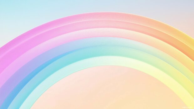 A pastel rainbow gradient with soft transitions between pale pink, lavender, mint green, and baby blue, set against a light sky.