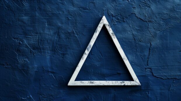 A simple navy blue wallpaper with a single, small white triangle in the corner.