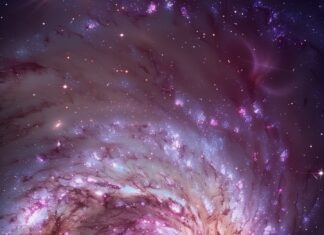 An ethereal purple galaxy with glowing nebulas and intricate star clusters, iPhone wallpaper.