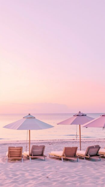 An iPhone preppy beach wallpaper with pink skies at dusk, neatly arranged loungers.