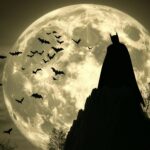 Batman silhouette against a giant full moon, with bats flying in the background.