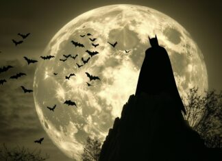 Batman silhouette against a giant full moon, with bats flying in the background.