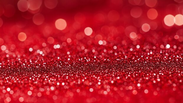 Bold red glitter background with a vibrant, HD image.