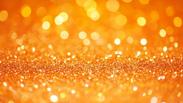 Bright orange glitter 4K wallpaper with a vibrant sparkle.