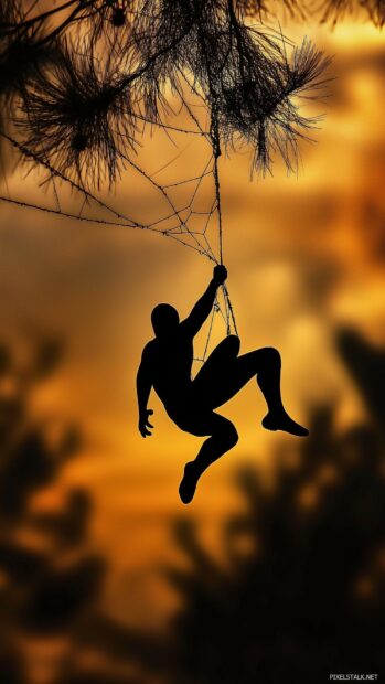 Cool Spiderman silhouette swinging on a web with a sunset background.